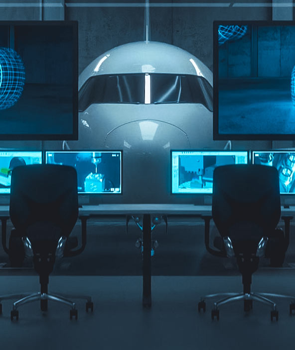 Une salle informatique faisant face à un hangar d’aviation avec un plan à l’intérieur