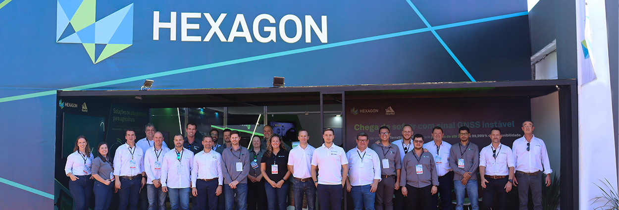 A group of people standing in front of an office building