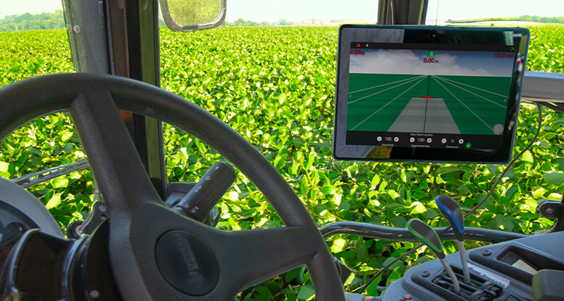 View of a field from inside a tractor