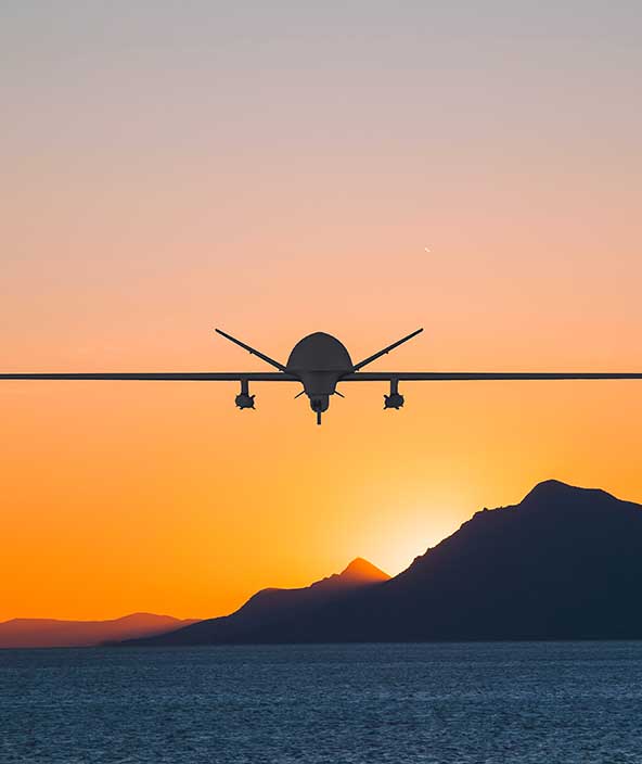 An aircraft flying into the sunset