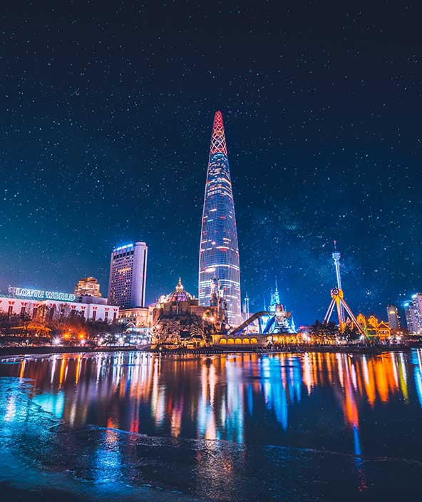 Night time image of the Lotte World Tower skyscraper in Seoul.