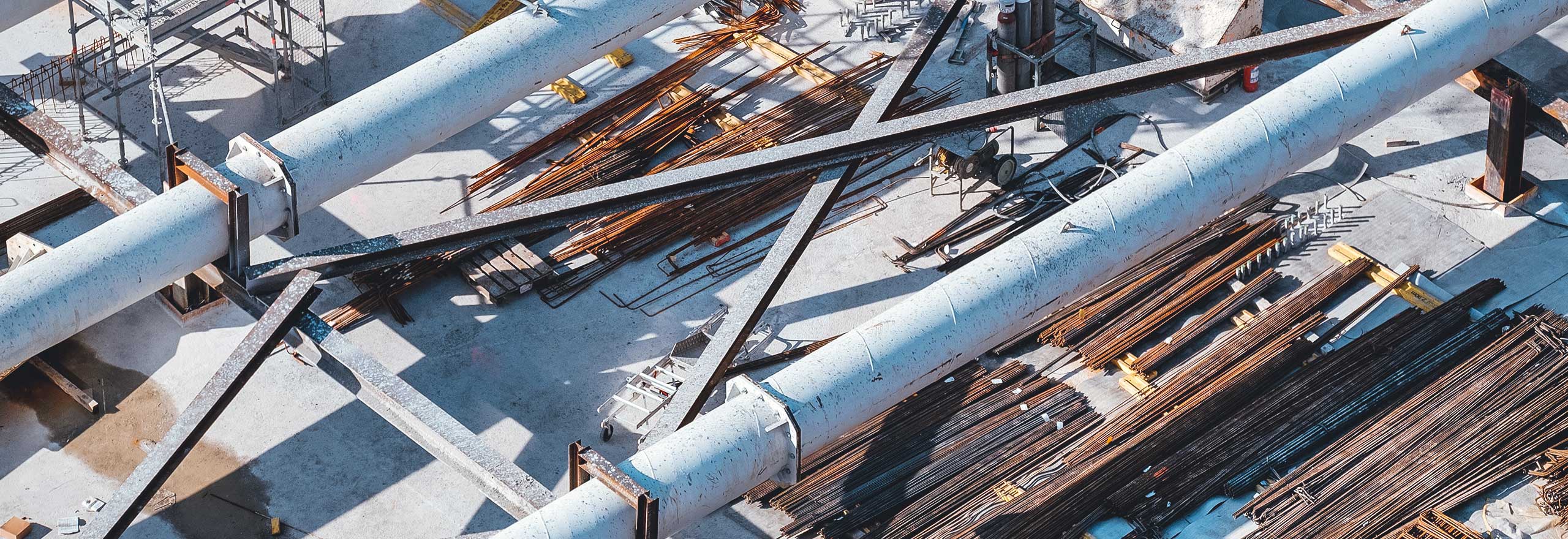 Image of pipes and scaffolding at construction site