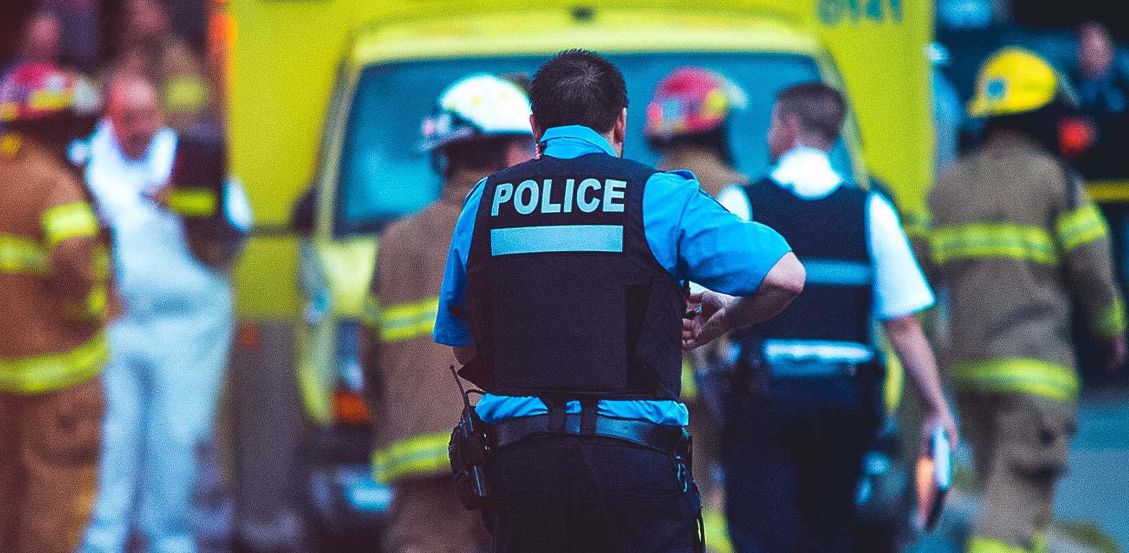 image of police with emergency service vehicle