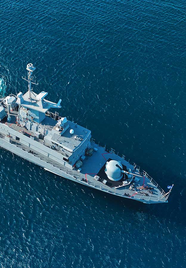 Aerial view of naval defence vessel in open water
