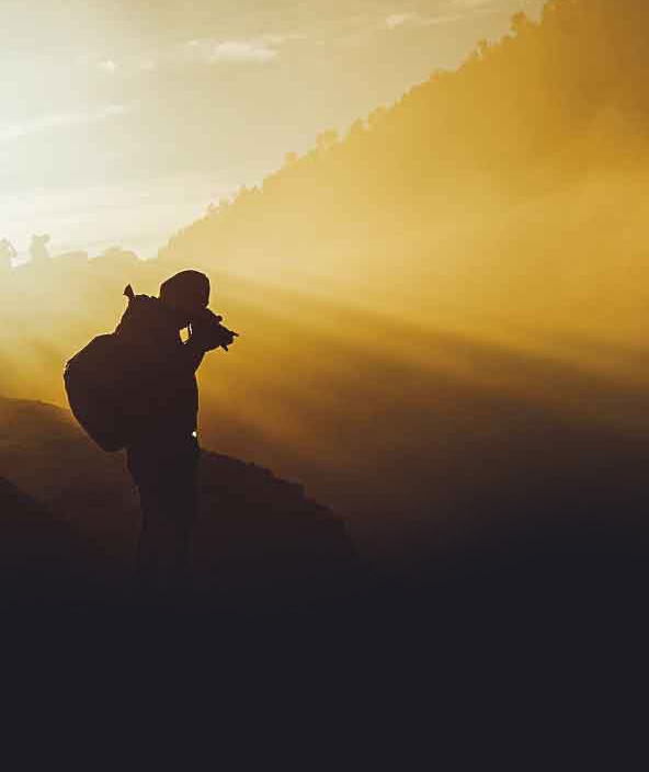 The silhouette of a soldier in a field