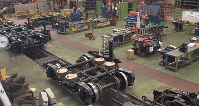 Image of an industrial workshop floor with machines using measurement tools 