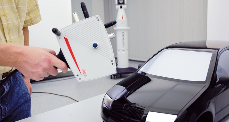 Image of person scanning a model of a car 