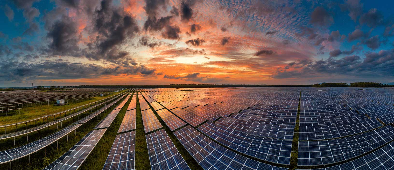 A large plot of solar panels shows Hexagon’s move toward a sustainable future.