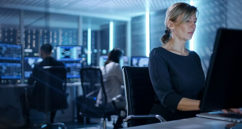 Woman working at computer station