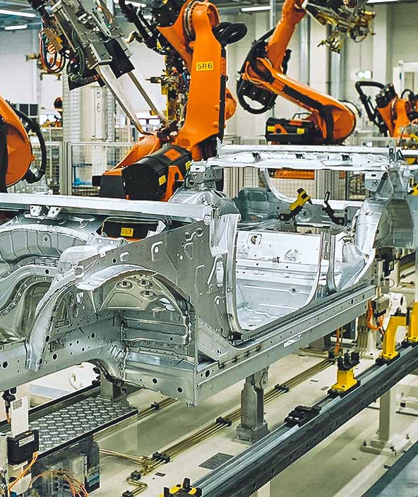 A row of mechanical arms in a manufacturing facility