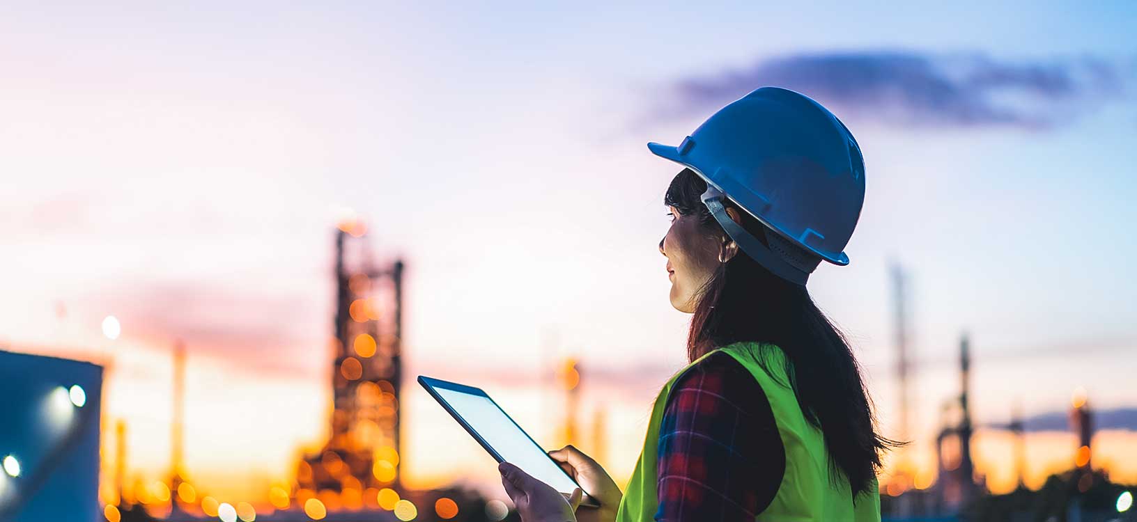 petrochemical engineer working at night with digital tablet