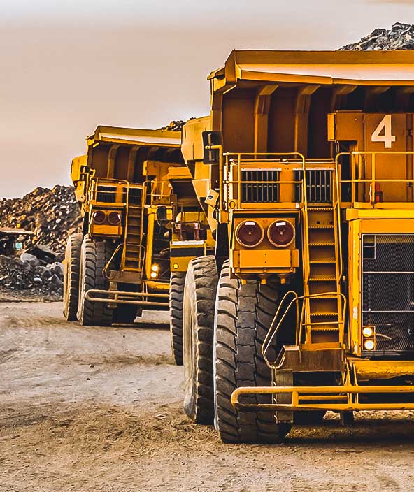 Two large construction vehicles on a construction site