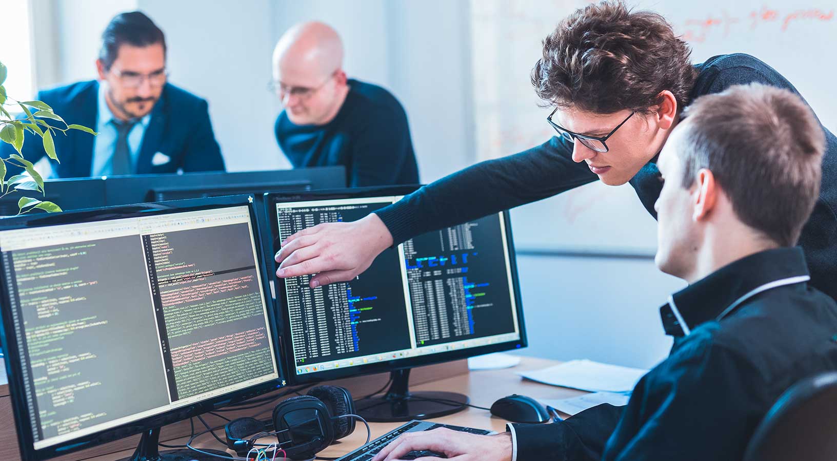AI developers collaborating and brainstorming