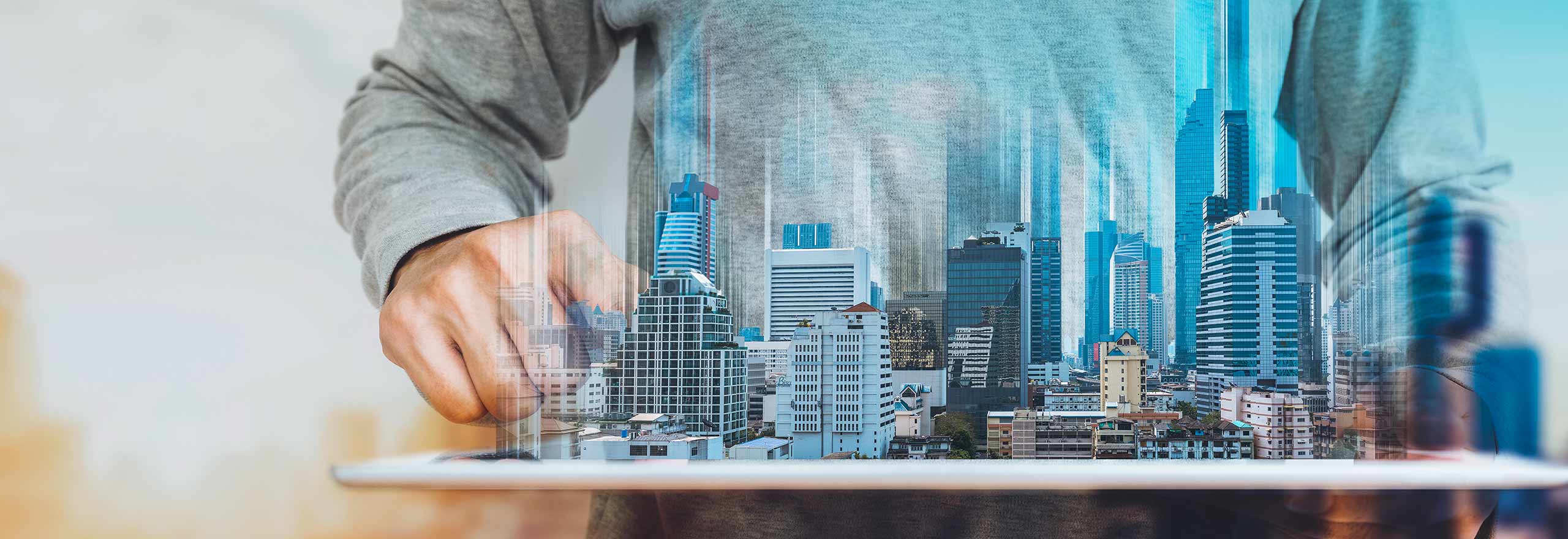 Composite image of a person overlooking a landscape comprised of commercial real estate