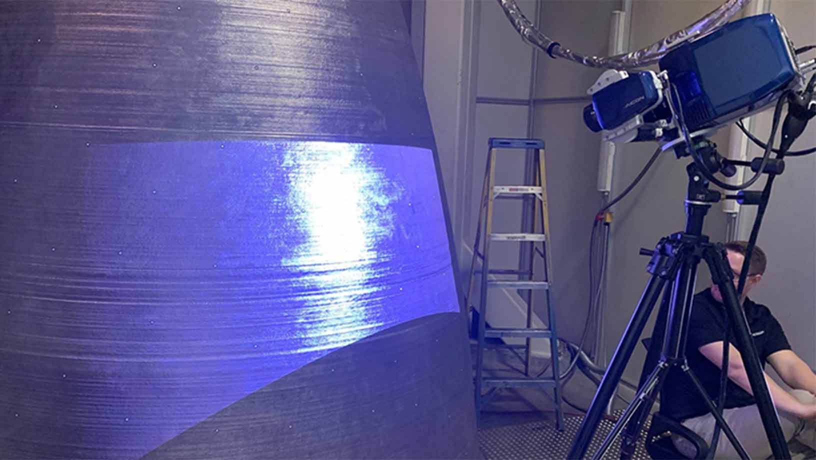 A structured light scanner projecting mesh onto a NASA RS-25