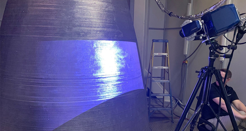 A structured light scanner projecting mesh onto a NASA RS-25