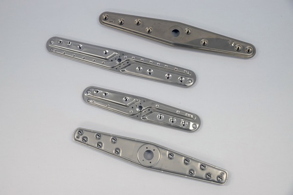 Examples of stamped components for various industries made by Parolin Stampi