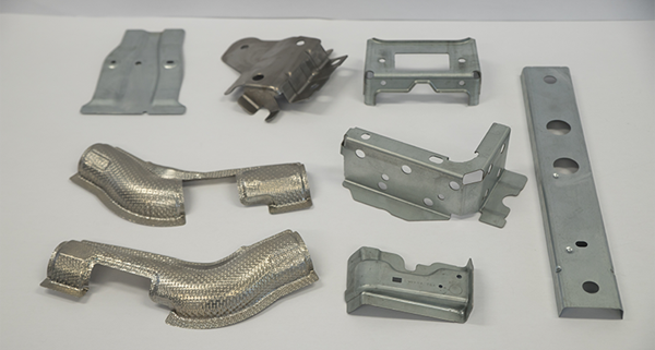 Examples of stamped components for various industries made by Parolin Stampi