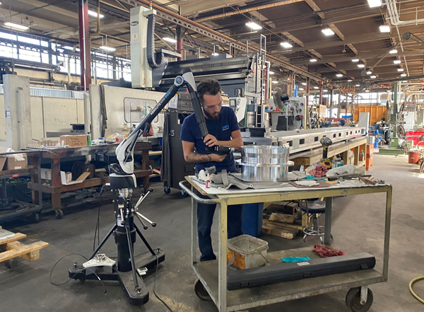 Primary Flow Signal’s high-volume manufacturing facility uses Inspire metrology software with a portable measuring arm meticulously performing inspection checks, embodying precision and efficiency in action.