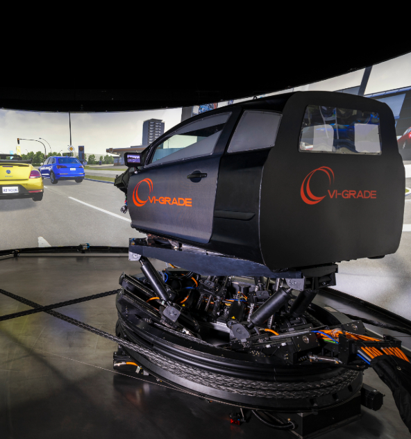 An image of the VI-Grade driving simulator in use