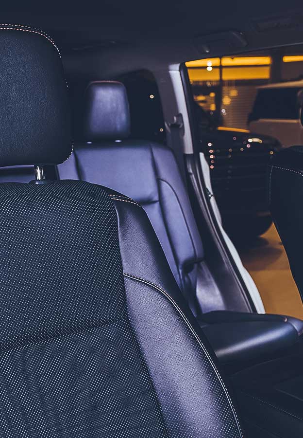 Black leather seat in a car cabin.