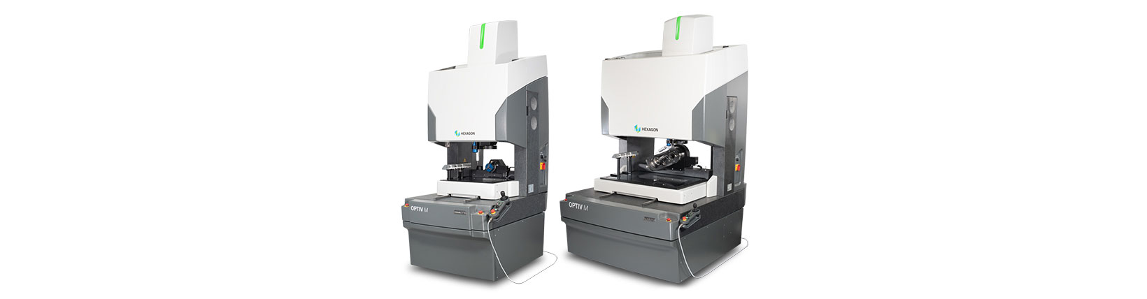 Two multisensor coordinate measuring machines next to each other on white background