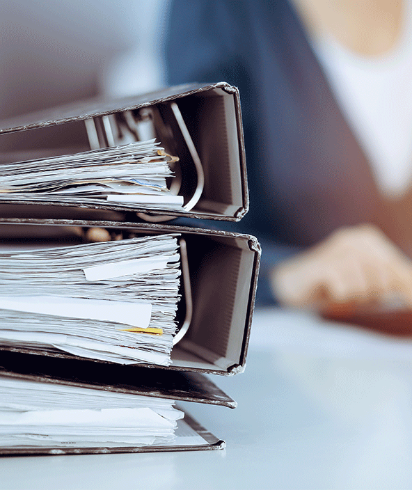 Three binders on a desk