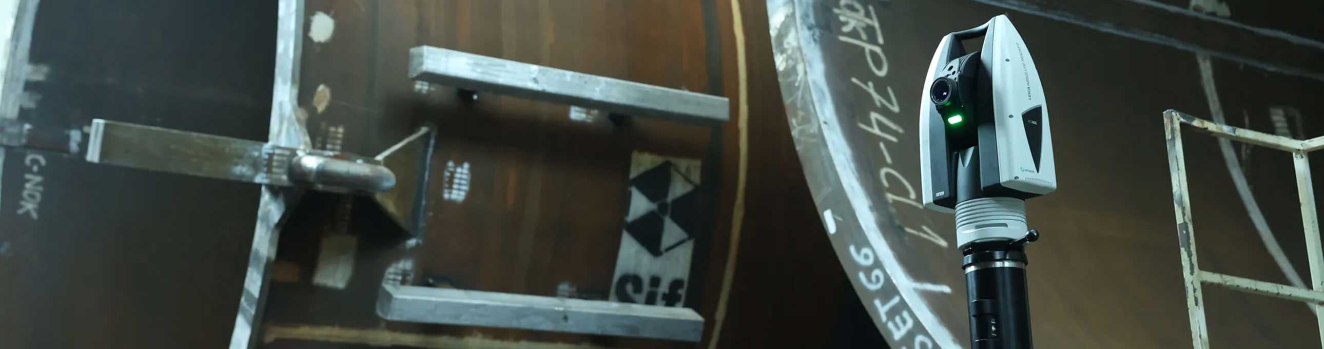 A laser tracker inspecting large metal tubes