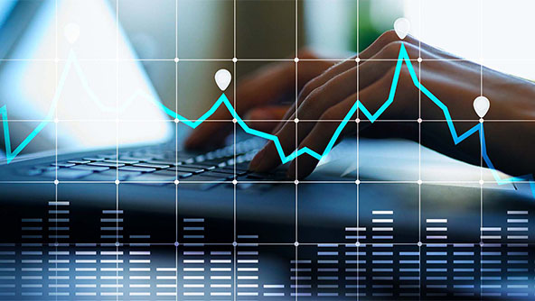 hands using a keyboard on a laptop