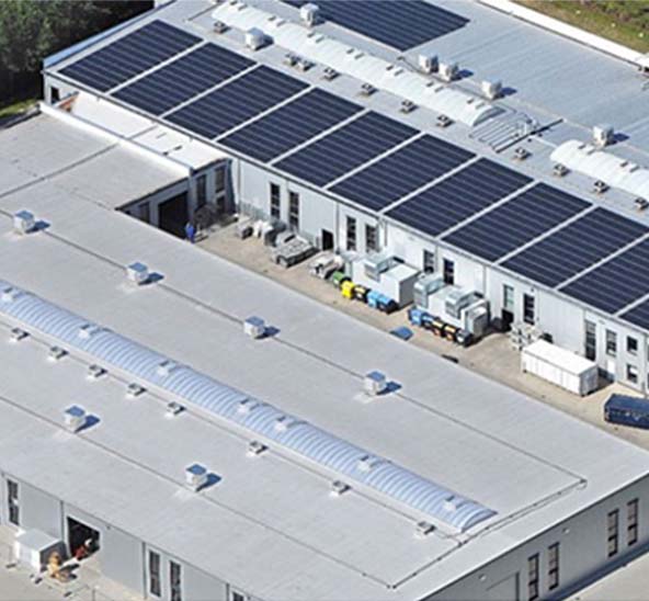 Image showing production facility depicting closed-loop manufacturing with solar panels on roof