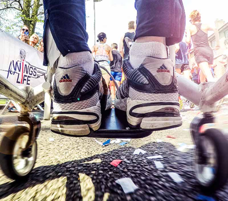 Wings for life race participant in wheelchair