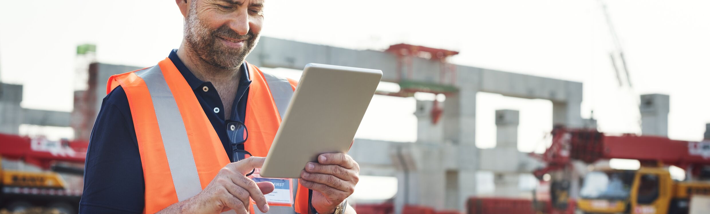 Utilities worker on job site uses tool tracking solution on his tablet to access tool information.