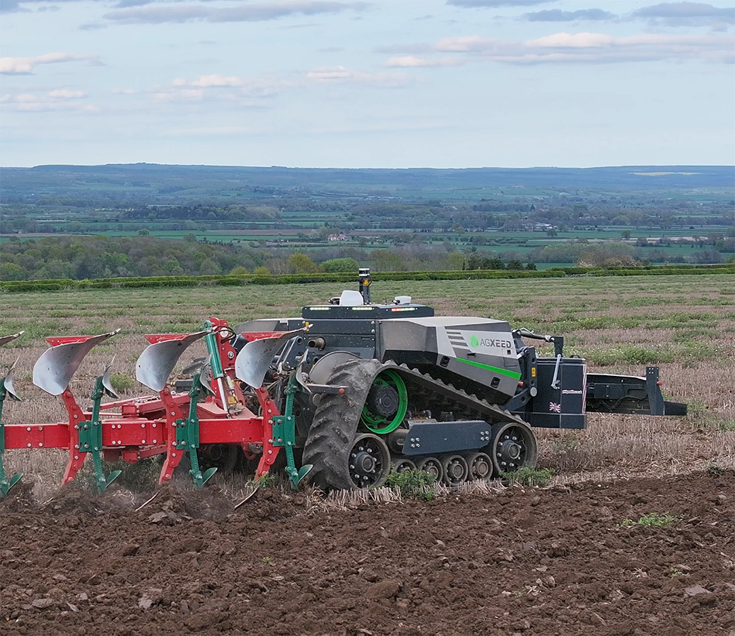 An autonomous farm vehicle in a field