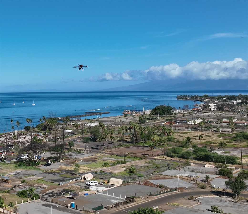 A drone flying above a small city
