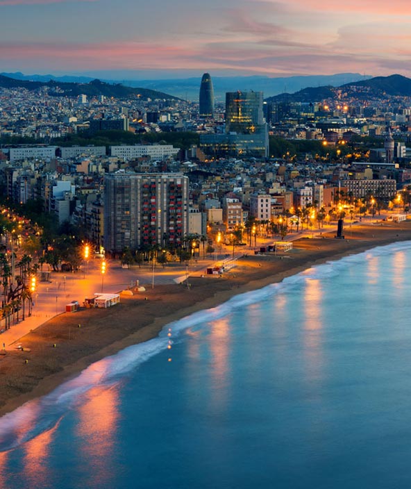 Barcelona city and beach at sunset