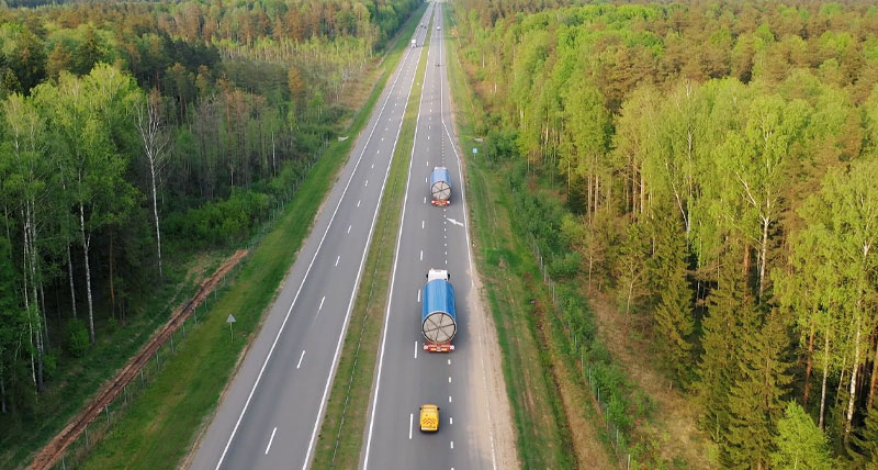 trucks driving on straight road