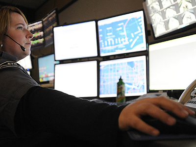 Female dispatcher uses I/CAD at a control center