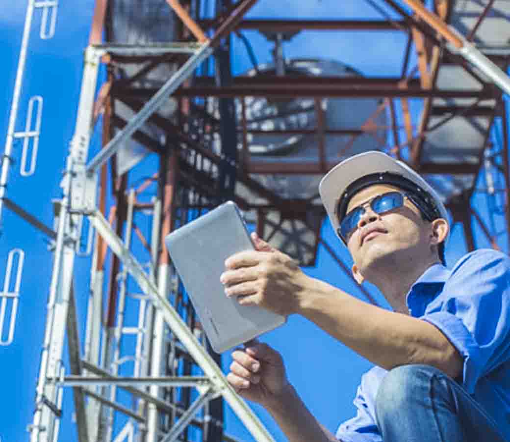 Worker with a tablet on an industrial site 