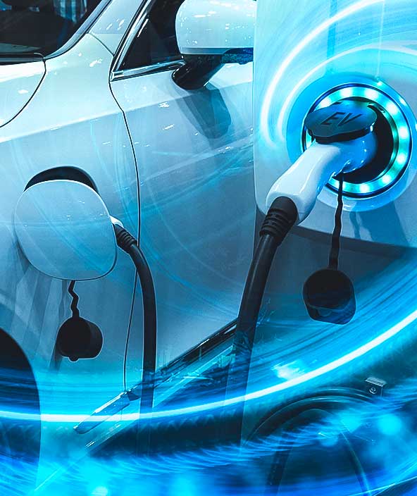 EV Car or Electric vehicle at charging station with the power cable supply plugged