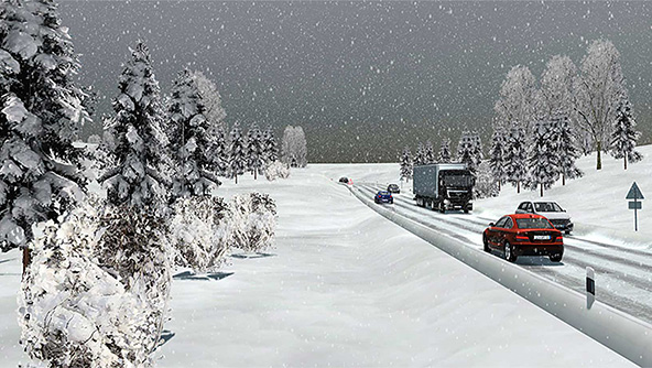 A simulated snow scene with cars and lorries on a motorway with snow and ice on the road
