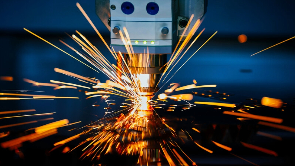A close-up view of a metal cutting machine, showcasing precision in sheet metal fabrication processes.