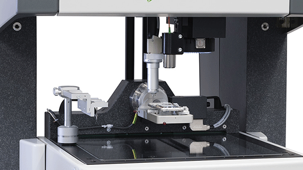 Multisensor CMM inspecting a complex precision part