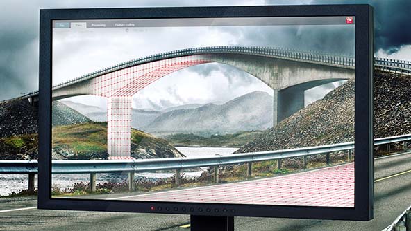 A large screen displaying a detailed image of a bridge, showcasing its architectural features and surrounding landscape.