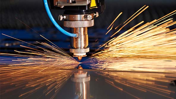 A laser cutting machine precisely cuts through metal