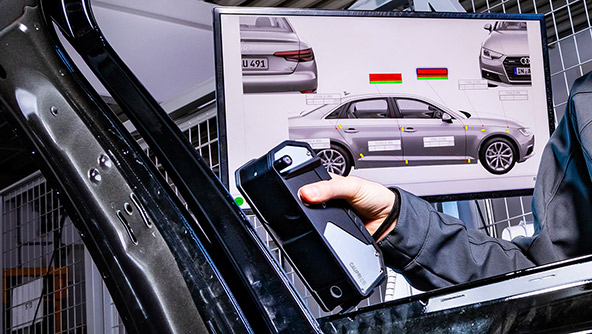 Image portraying a technician closely inspecting a car with a CALIPRI C15