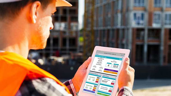 Man looking at tablet device displaying Nexus
