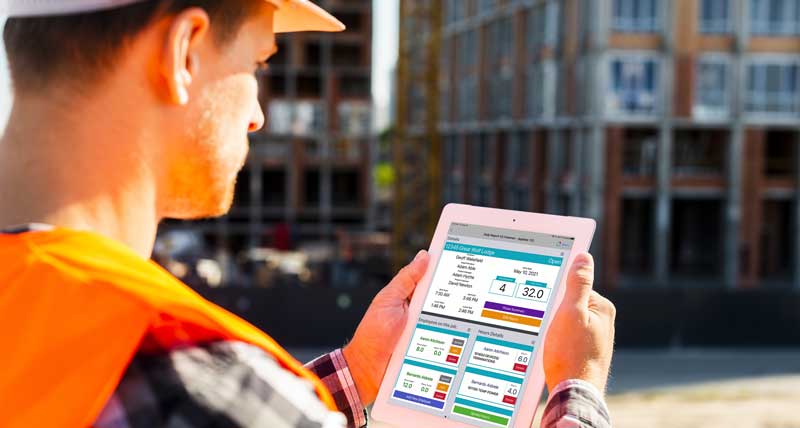 Worker showing his' tablets interface of the daily report solution where he is tracking project progress on the job site. 