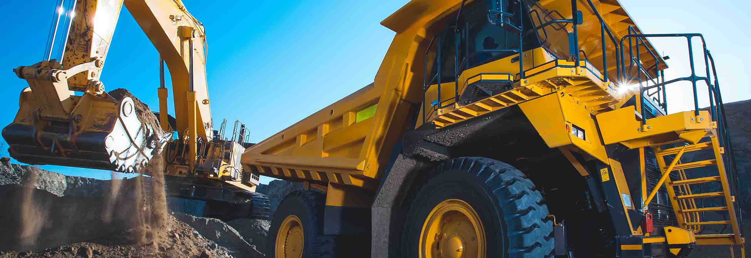 earthmoving digger in operation lifting soil