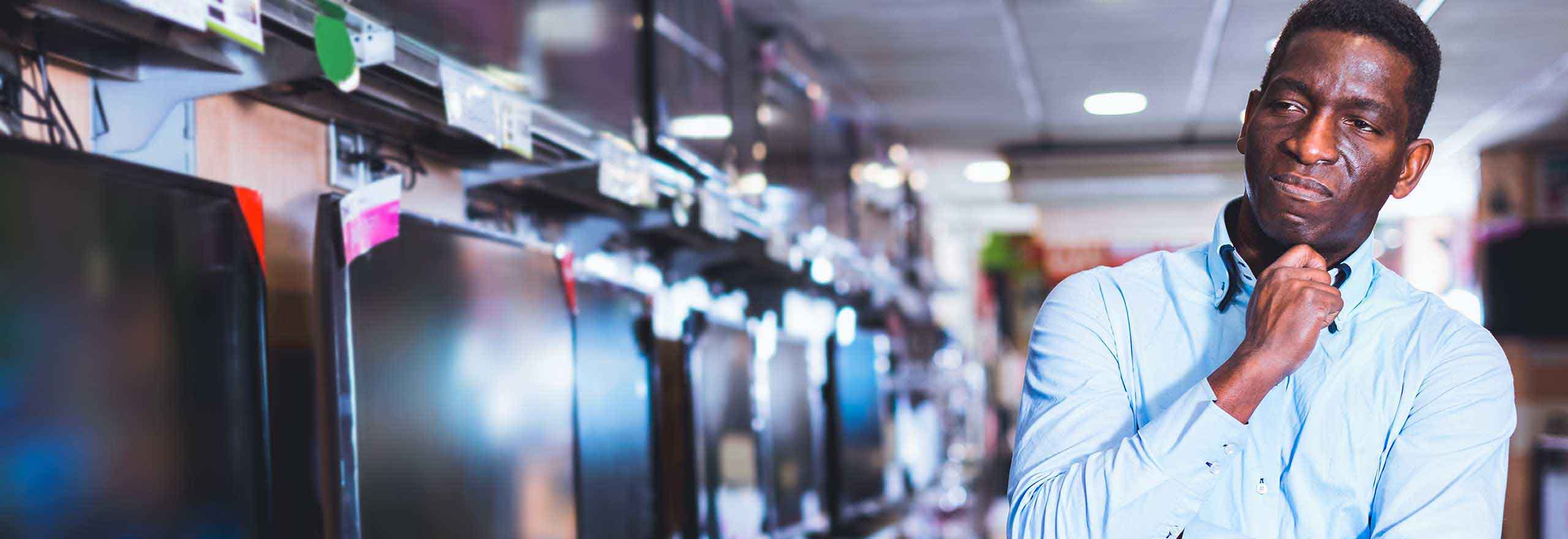 Man looking for consumer products in a store