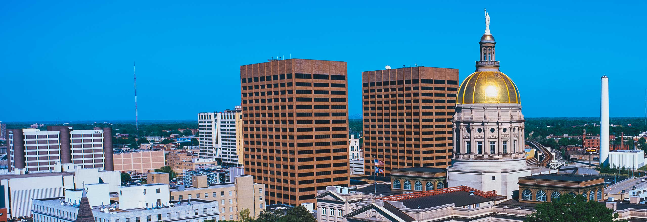 state capitol and skyline in daylight